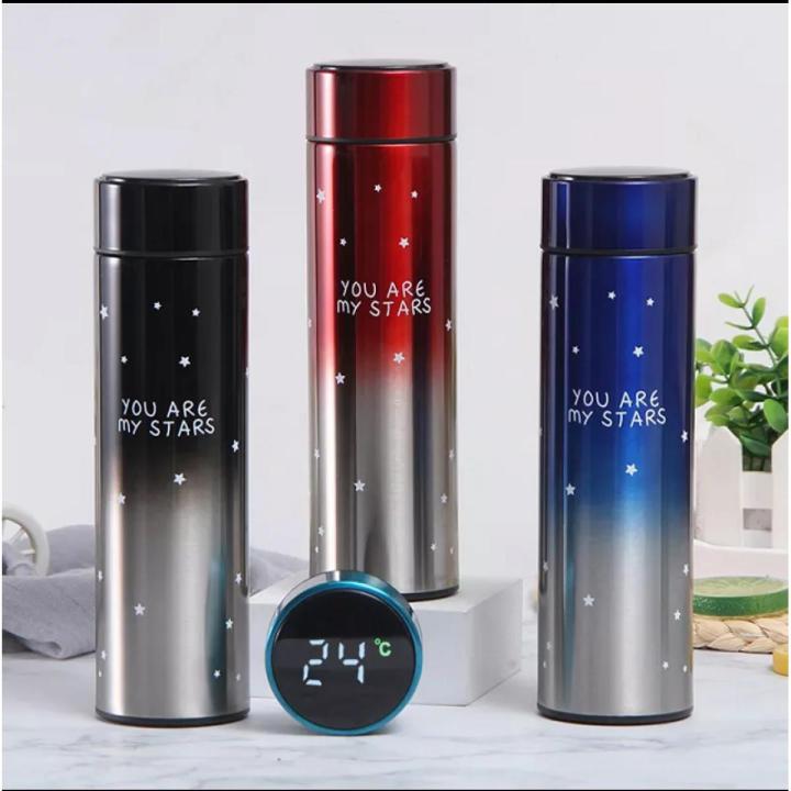 Three gradient-colored thermos bottles with 'You are my stars' text, accompanied by a digital thermometer.