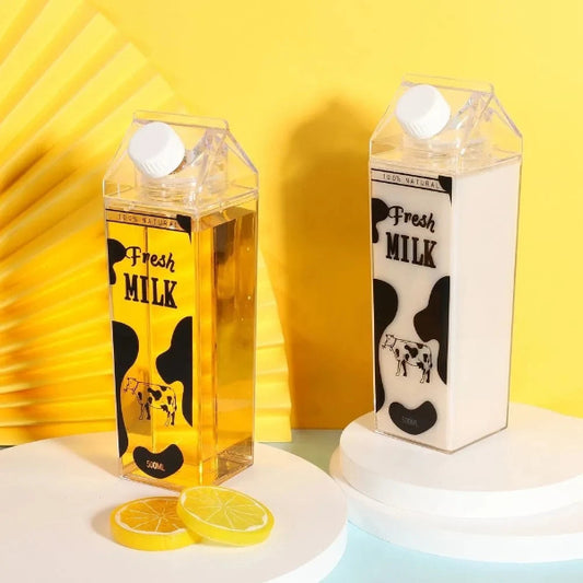 Two milk carton-shaped bottles with 'Fresh Milk' text on a yellow background