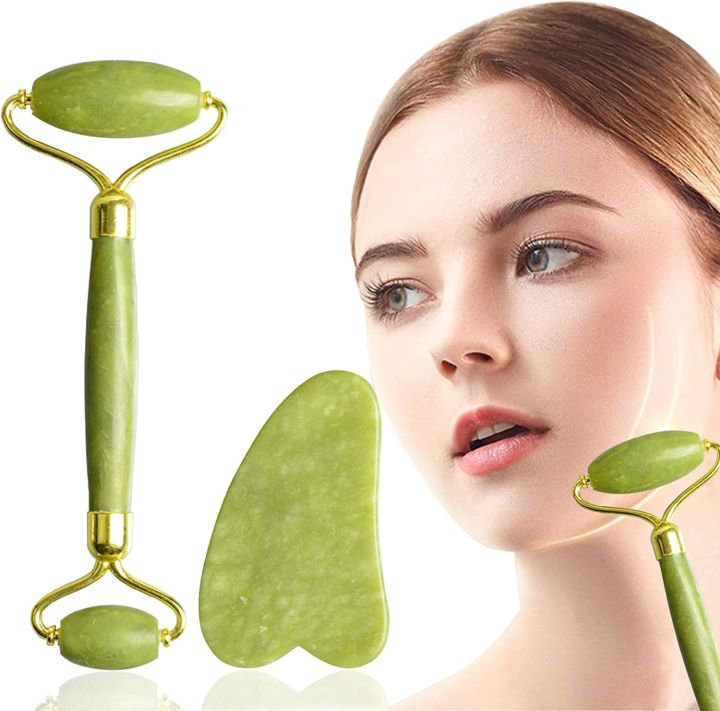 Green jade roller and gua sha tool with a woman's face for skincare.