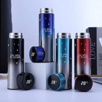Set of insulated travel mugs with digital temperature displays on a white surface.