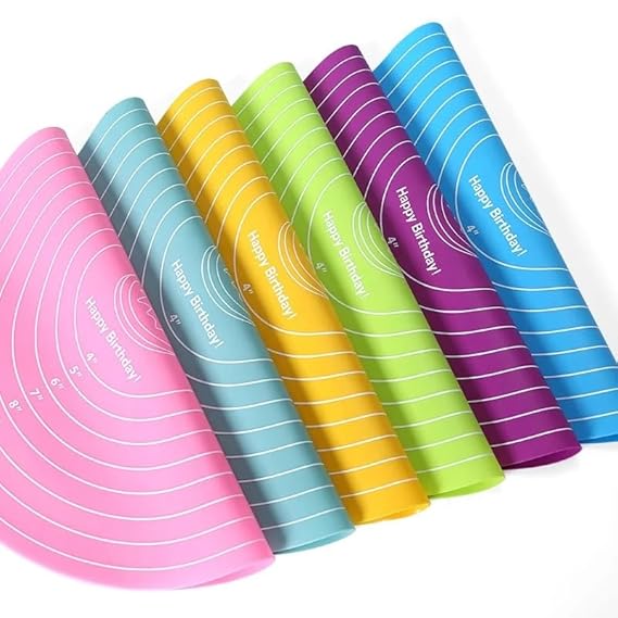 Set of colorful rolling mats with 'Happy Birthday!' text on a white background