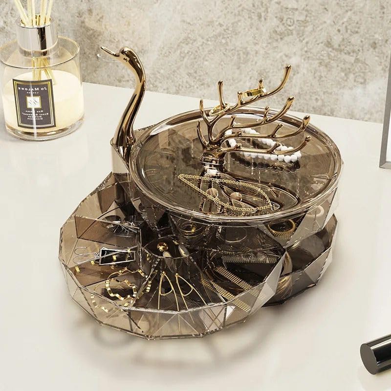 Decorative metal tray with deer antlers on a white surface