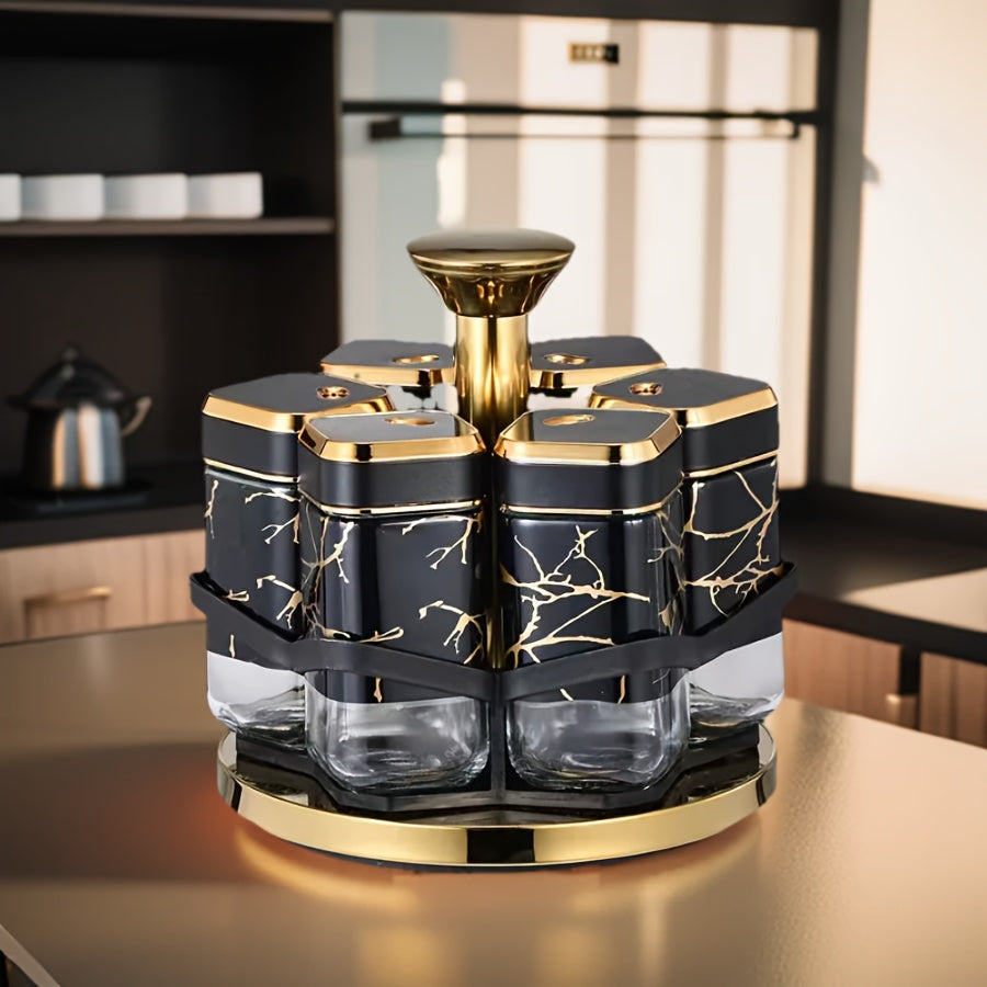 Decorative kitchen canister set with black and gold design on a countertop.