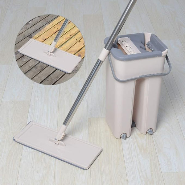 Mop with bucket on a wooden floor, showing close-up of mop head.
