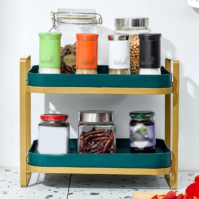 Three-tiered metal organizer with jars on a white surface