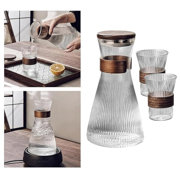 Clear glass carafe with wooden accents and matching glasses on a white background.