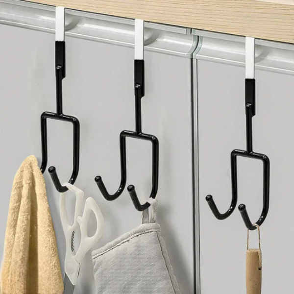 Over-the-door hook organizer with multiple hooks hanging on a closet door.