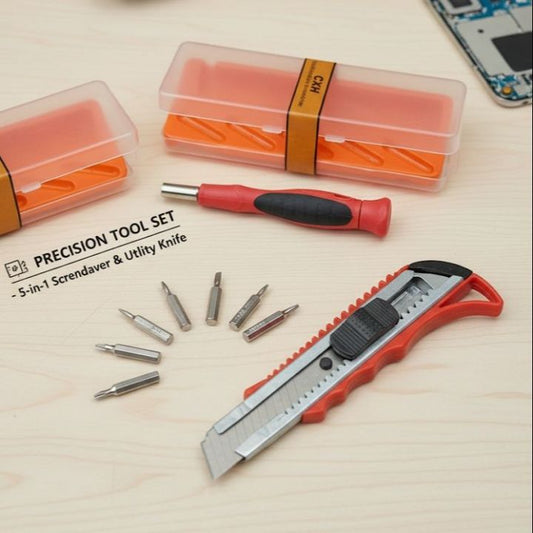 Precision tool set with a knife and attachments on a wooden surface