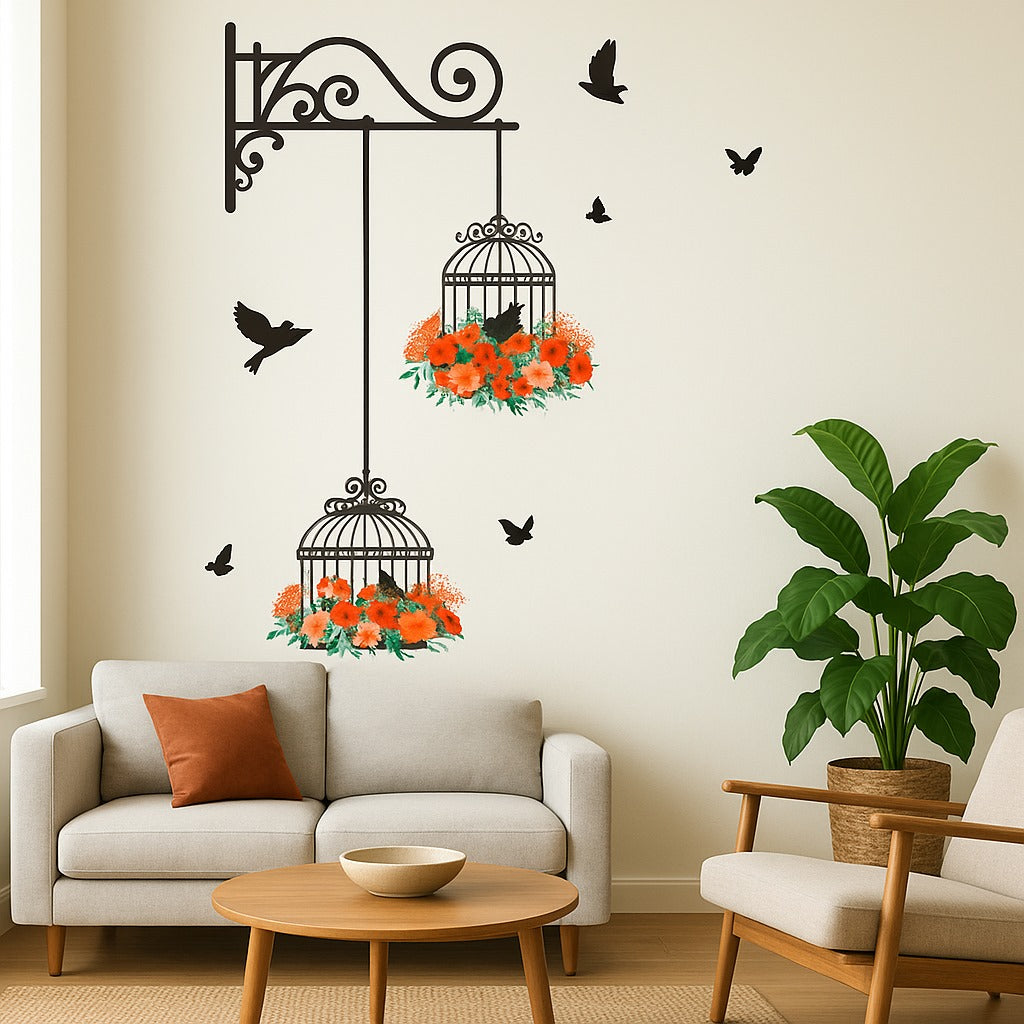 Living room with decorative wall stickers of birdcages and flowers, a plant, and a sofa.
