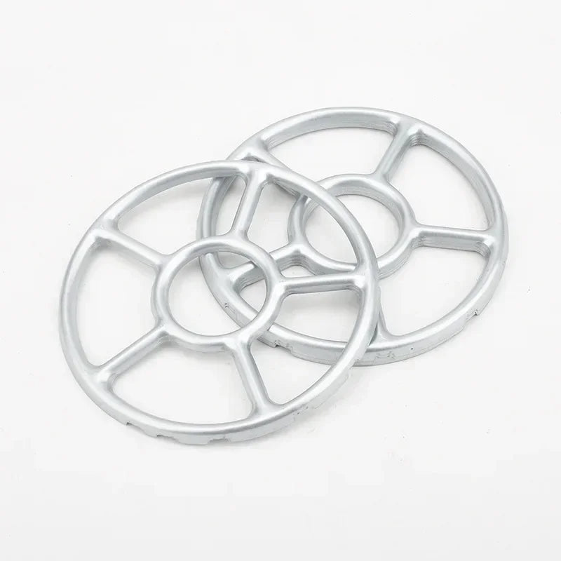 Two metallic wheel rims on a white background