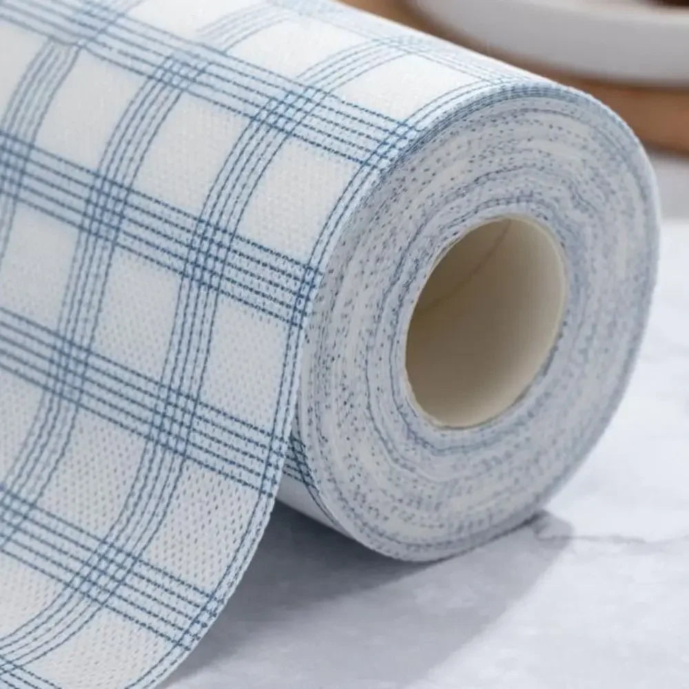 Roll of blue and white checkered wallpaper on a light gray surface