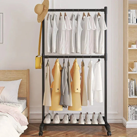 Clothing rack with clothes and shoes in a bedroom setting