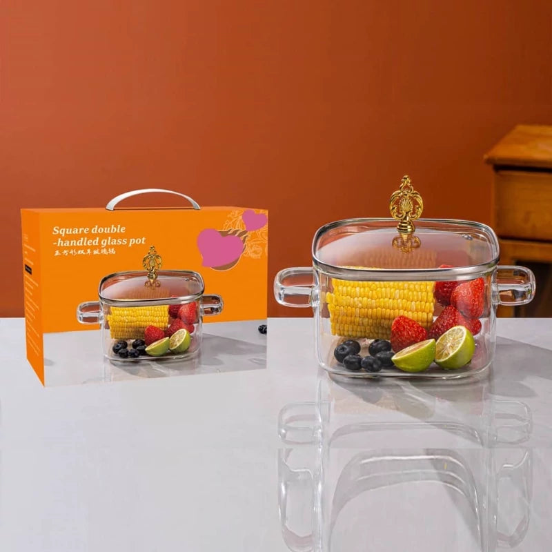Clear glass containers with fruits and vegetables on a white surface with an orange background