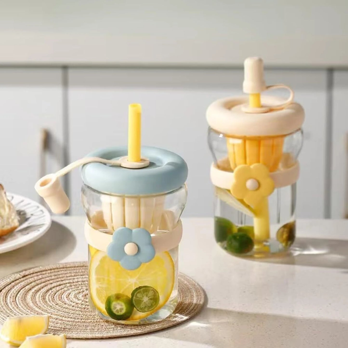 Two glass jars with colorful lids and straws on a light surface.
