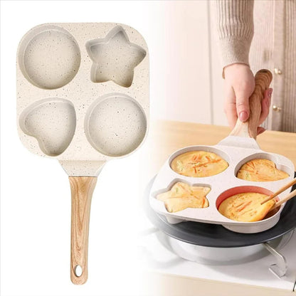 Baking tray with various shapes and a person holding a wooden spatula.