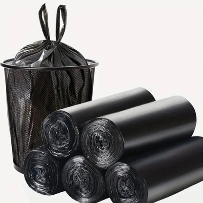 Black trash bags with a trash can on a white background