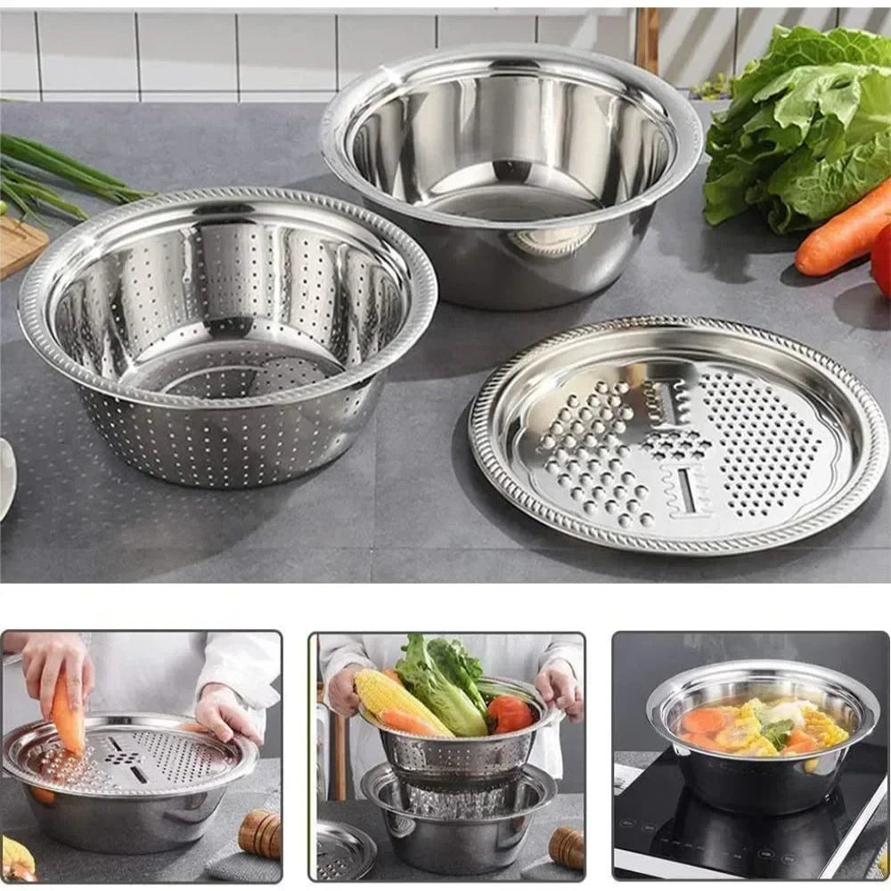 Set of stainless steel kitchen utensils including a colander, grater, and steamer basket on a kitchen counter.
