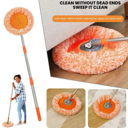Cleaning tool with orange pad and telescopic handle, used on a wooden floor.