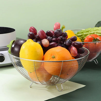 Wire fruit basket with fruits on a kitchen counter