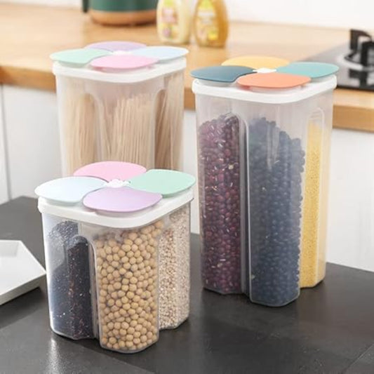 Set of four transparent kitchen storage containers with colorful lids on a kitchen counter.