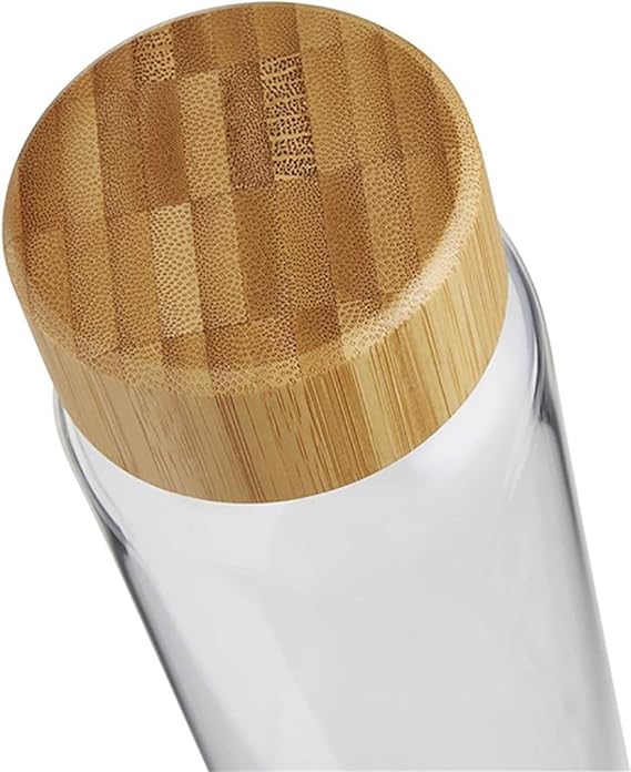 Glass bottle with a bamboo cap on a white background