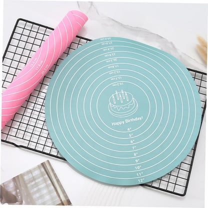 Teal silicone baking mat with measurement markings on a cooling rack