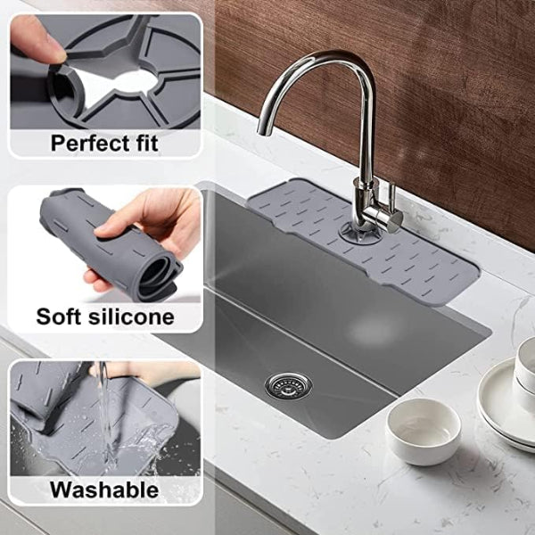 Gray silicone sink mat with faucet and kitchen items on a countertop