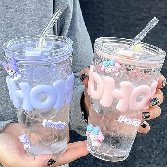 Two clear tumblers with 'HOHO' text and decorative elements held by a person.