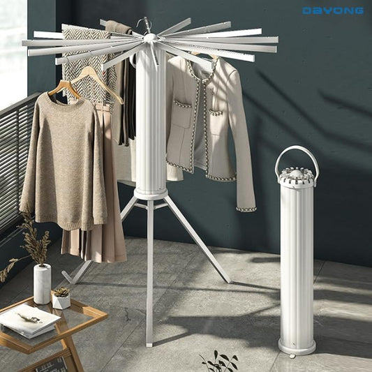 Clothes drying rack with clothes and a cylindrical dryer on a gray floor.