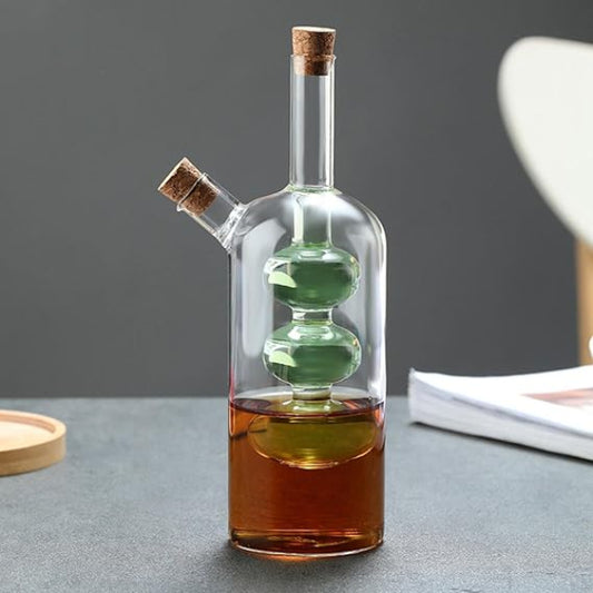 Glass bottle with cork stoppers containing different liquids on a gray surface.