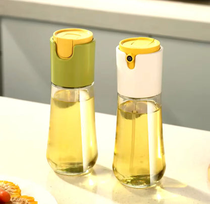 Two glass bottles with yellow lids on a light surface.