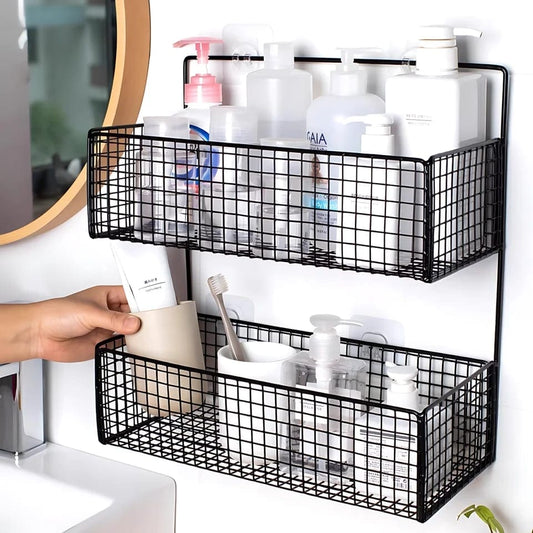 Black wire wall-mounted storage baskets with toiletries in a bathroom setting.