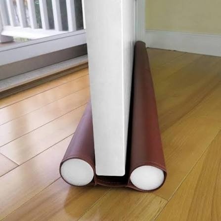 Door gap stopper for blocking drafts dust and light