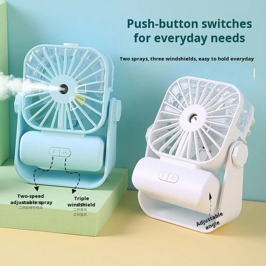 Two handheld fans with spray feature on a light blue background
