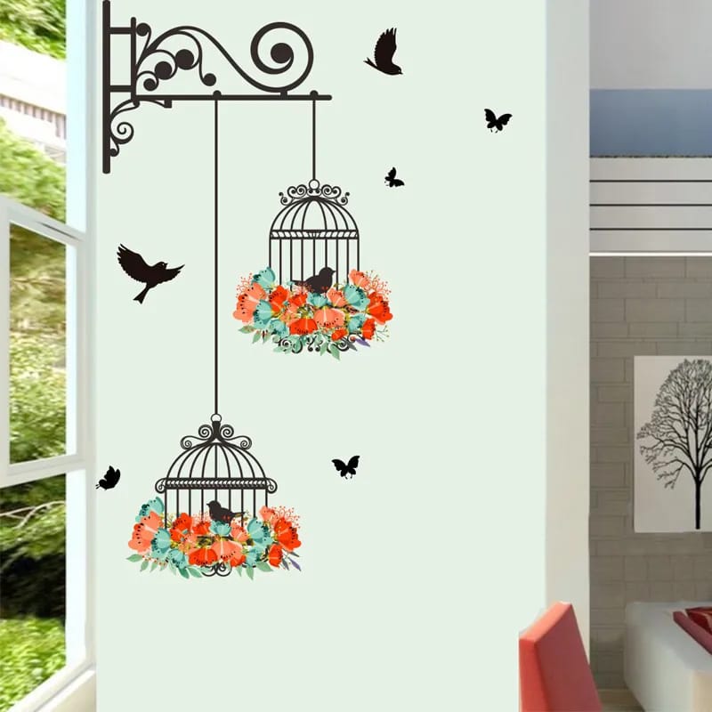 Decorative wall stickers of birdcages with flowers and birds on a white wall.