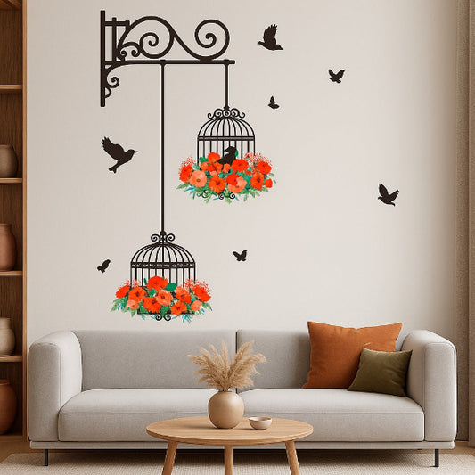 Decorative wall decal of a birdcage with flowers on a wall above a sofa.