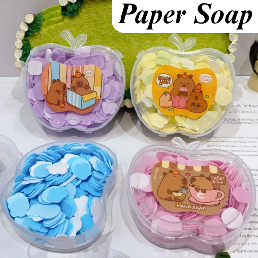 Four containers of paper soap with cartoon bear designs on a white surface.