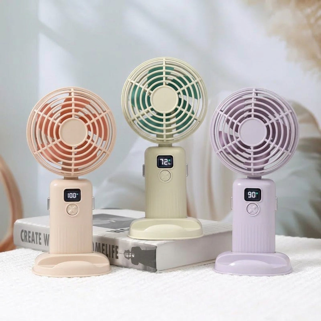 Three small fans in different colors with digital displays on a light background