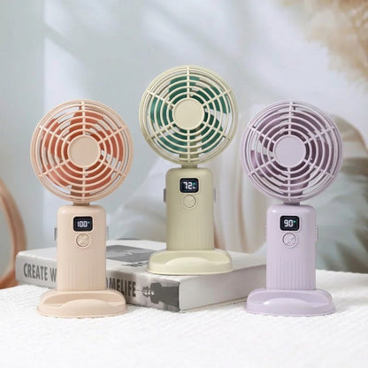 Three small fans in different colors with digital displays on a light background