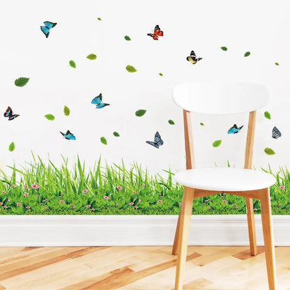 Chair with grass and butterfly wall decals on a white wall.
