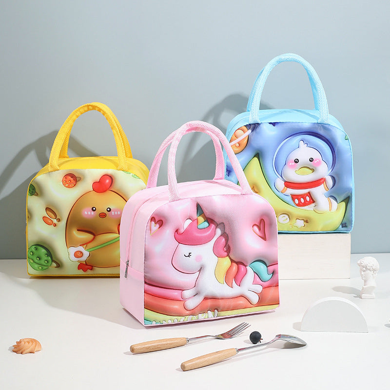 Three colorful children's lunch bags with cartoon designs on a light surface.