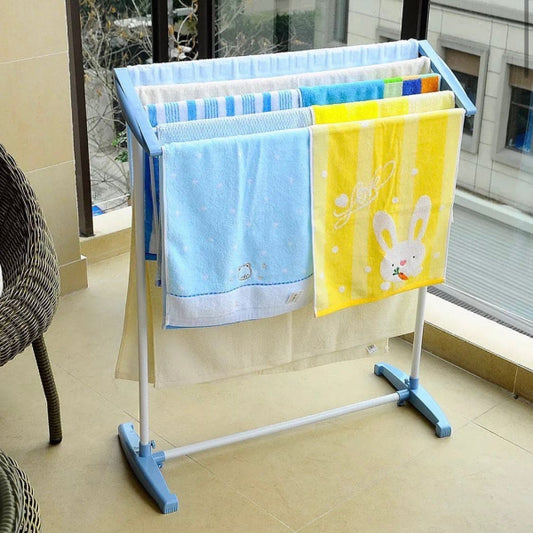 Towel rack with blue and yellow towels on a tiled floor